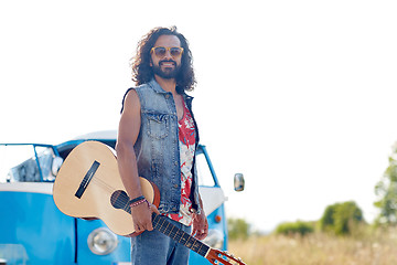 Image showing hippie man with guitar over minivan car outdoor