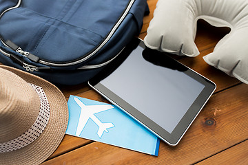 Image showing close up of tablet pc and traveler personal stuff