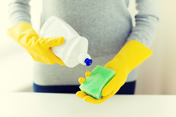 Image showing close up of woman with sponge and cleanser