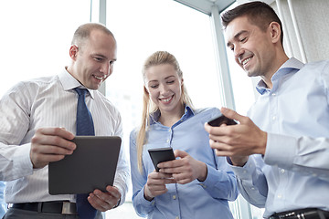 Image showing business people with tablet pc and smartphones