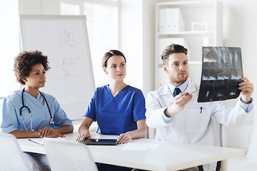 Image showing group of doctors discussing x-ray image