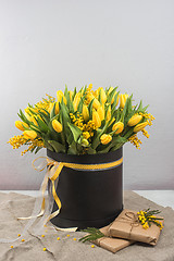 Image showing Bright spring bouquet of tulips and mimosa flowers