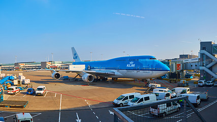 Image showing KLM plane being loaded at Schiphol Airport. Amsterdam, Netherlands