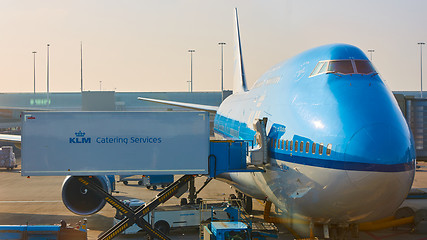 Image showing KLM plane being loaded at Schiphol Airport. Amsterdam, Netherlands