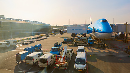 Image showing KLM plane being loaded at Schiphol Airport. Amsterdam, Netherlands