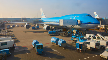 Image showing KLM plane being loaded at Schiphol Airport. Amsterdam, Netherlands