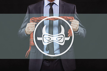 Image showing man in business suit with chained hands. handcuffs for sex games. concept of erotic entertainment.