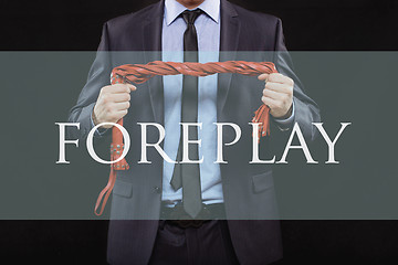 Image showing man in business suit with chained hands. handcuffs for sex games. concept of erotic entertainment. foreplay