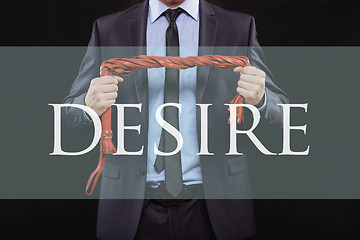 Image showing man in business suit with chained hands. handcuffs for sex games. concept of erotic entertainment. desire