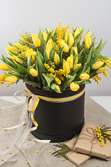 Image showing Bright spring bouquet of tulips and mimosa flowers