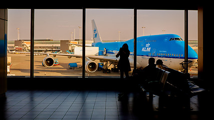 Image showing KLM plane being loaded at Schiphol Airport. Amsterdam, Netherlands