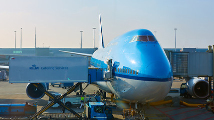 Image showing KLM plane being loaded at Schiphol Airport. Amsterdam, Netherlands