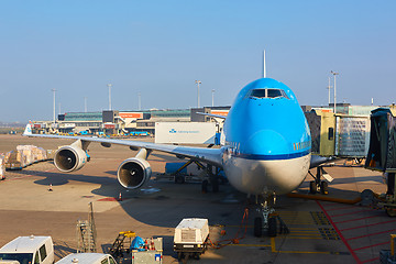 Image showing KLM plane being loaded at Schiphol Airport. Amsterdam, Netherlands