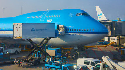 Image showing KLM plane being loaded at Schiphol Airport. Amsterdam, Netherlands