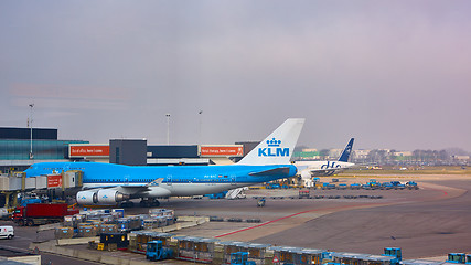 Image showing KLM plane being loaded at Schiphol Airport. Amsterdam, Netherlands