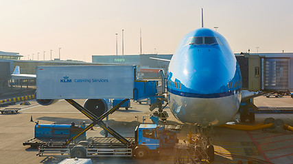 Image showing KLM plane being loaded at Schiphol Airport. Amsterdam, Netherlands