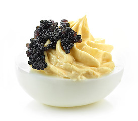 Image showing boiled stuffed egg with black caviar