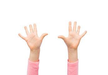 Image showing close up of little child hands raised upwards