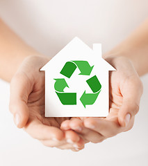 Image showing hands holding house with green recycling sign