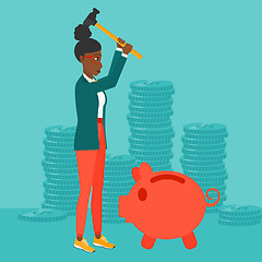 Image showing Woman breaking piggy bank.