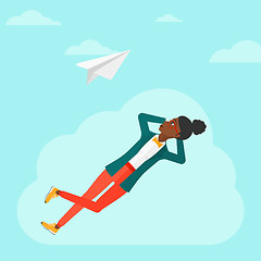 Image showing Business woman relaxing on cloud.