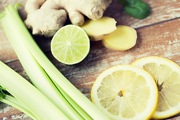 Image showing close up of ginger, celery and lemon on table