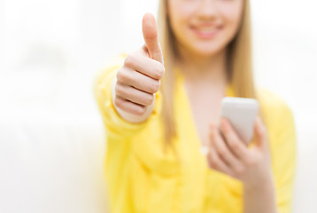 Image showing close up of woman with smartphone at home