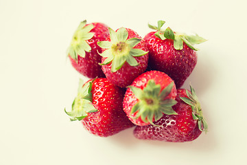 Image showing juicy fresh ripe red strawberries on white