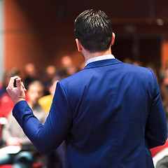 Image showing Public speaker giving talk at Business Event.