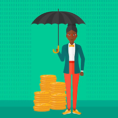 Image showing Woman with umbrella protecting money.