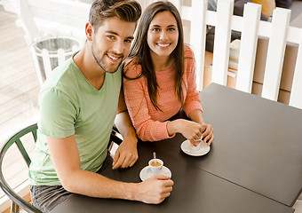 Image showing Young couple drinking coffee