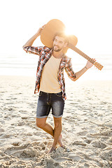 Image showing Handsome young man at the beach