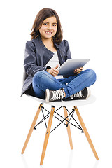 Image showing Young girl using a tablet