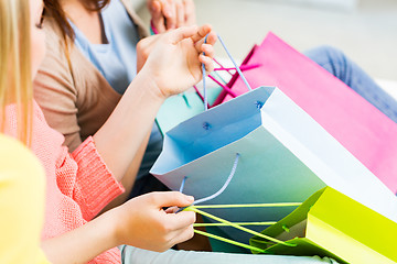 Image showing close up of happy teenage girls with shopping bags