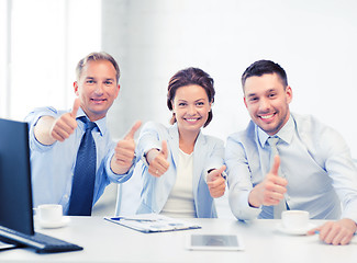 Image showing business team showing thumbs up in office