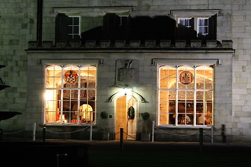 Image showing stately home windows and door lit at night