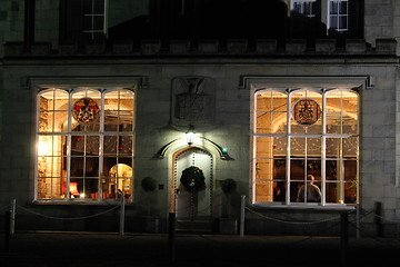 Image showing stately home windows and door lit at night