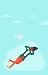 Image showing Business woman relaxing on cloud.