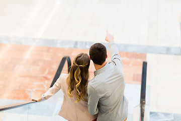 Image showing happy young couple with shopping bags in mall