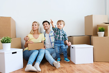 Image showing happy family with boxes moving to new home