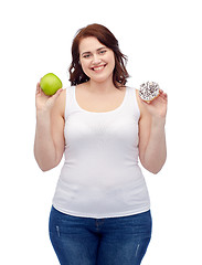 Image showing happy plus size woman choosing apple or cookie