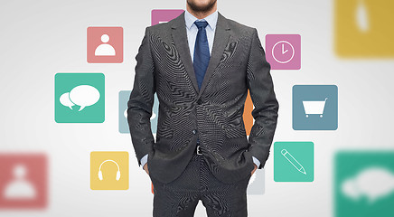 Image showing close up of businessman in suit with menu icons