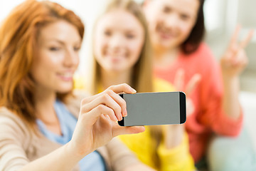 Image showing close up of friends taking selfie with smartphone