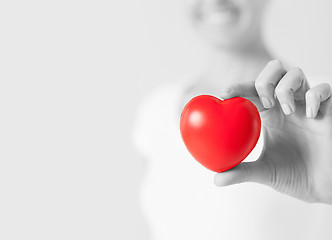 Image showing happy woman with small red heart