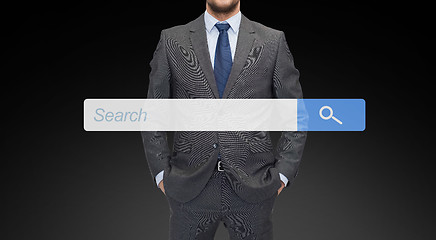 Image showing close up of businessman with internet search bar