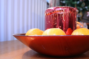 Image showing festive candle and clementines