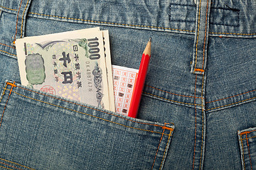 Image showing Japanese money and lottery bet slip in pocket