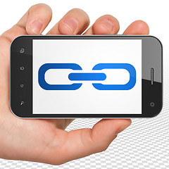 Image showing Web design concept: Hand Holding Smartphone with Link on display