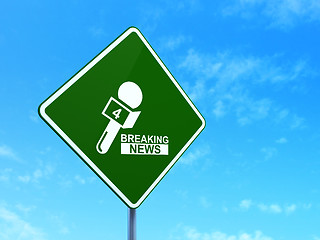 Image showing News concept: Breaking News And Microphone on road sign background