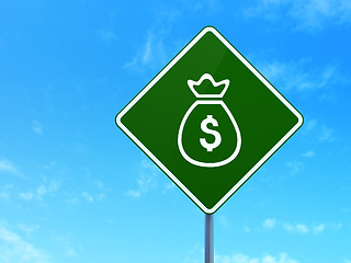 Image showing Currency concept: Money Bag on road sign background